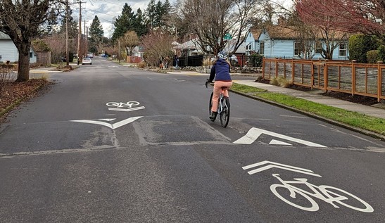 Person cycling through a bicycle-friendly speed bump