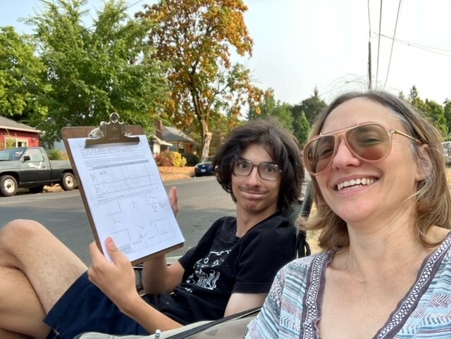 Bicycle count volunteers Sue and Zen counting at N Wabash Avenue & N Halleck Street in August 2023