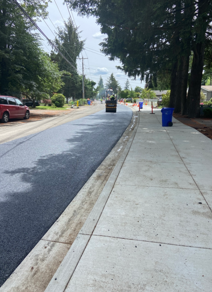Smooth pavement next to new sidewalk on SE 174th Avenue