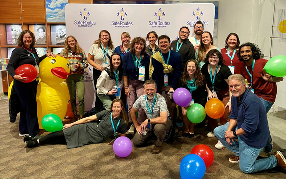 More than a dozen Safe Routes to School practitioners from Oregon gather together for a photo at the Safe Routes Partnership conference.