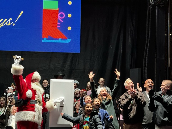 Elected officials and special guests react to the lighting of Portland's holiday tree at Pioneer Courthouse Square
