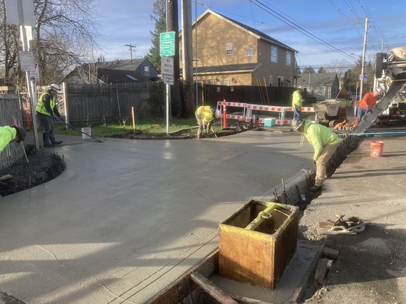 Crews with PBOT contractor modernize the sidewalk on E Burnside near 94th Avenue