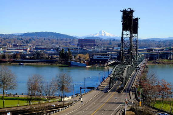 Hawthorne Bridge in the foreground and Mt. Hood in background, with view of  Willamette River and Central Eastside Portland