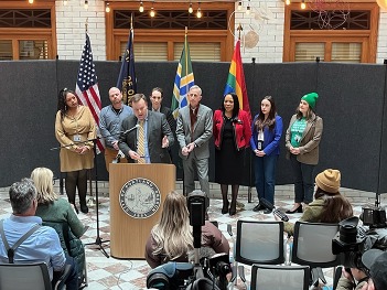 City Attorney Robert Taylor, Mayor Wilson, and councilors stand at press conference
