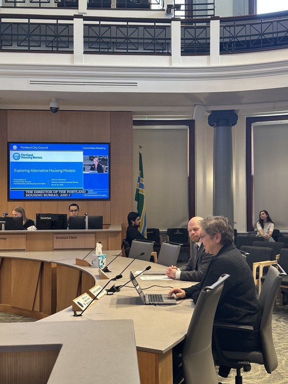 Councilor Mitch Green and Director Helmi Hisserich introduce the social housing resolution to City Council