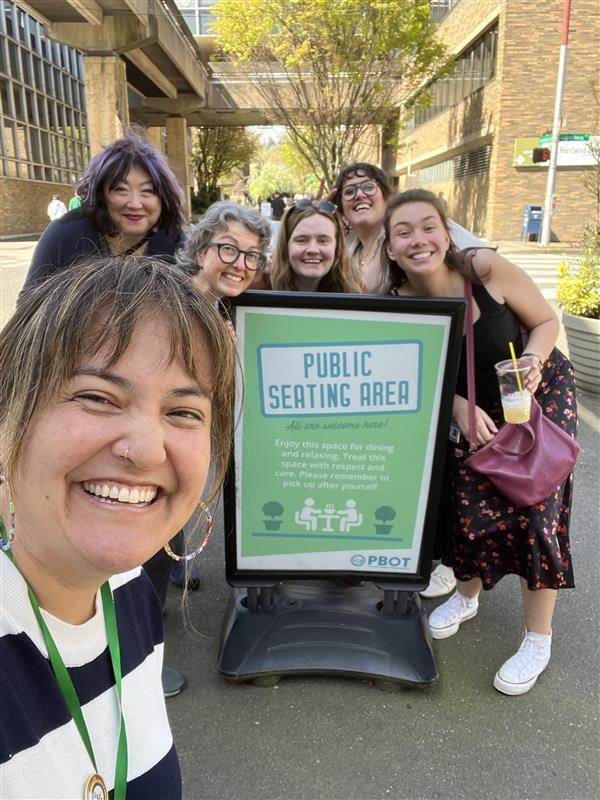 Councilor Koyama Lane with staffers in a public seating area