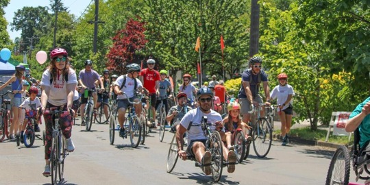PPR -  Group of people riding bikes on a road 