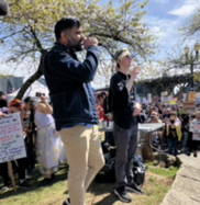Councilor Sameer Kanal speaks to the crowd at the Japanese American Historical Plaza