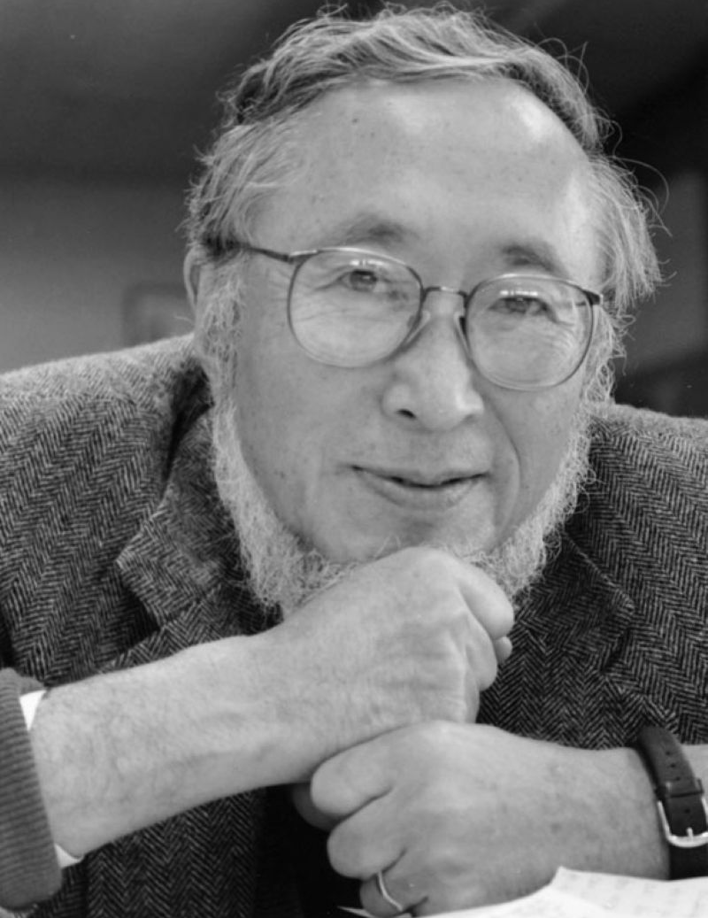 PPR - Older man with glasses resting head on stacked fists