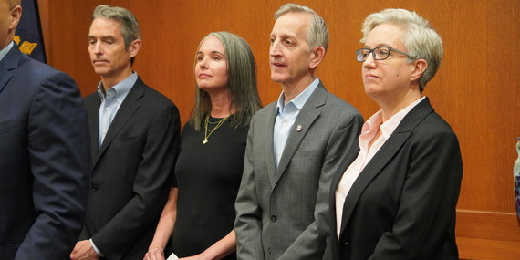 Portland Mayor Keith Wilson and Oregon Governor Tina Kotek stand with others at news conference