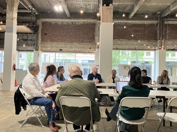 Councilor Green at an economic roundtable in downtown