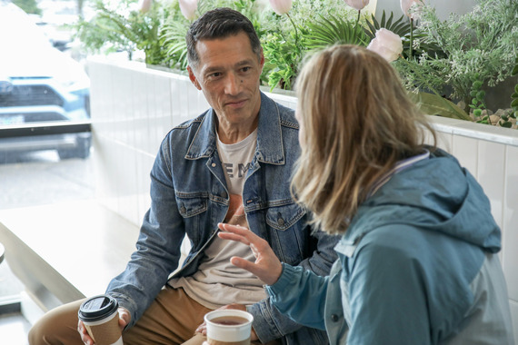 Jon Bebe speaks with someone in a local Vietnamese coffee and bubble tea shop