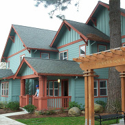 Housing photo with green buildings and lawn