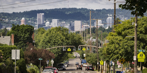 Southeast Portland street with traffic signals looking west toward downtown