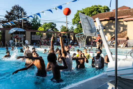 Outdoor pool and children playing