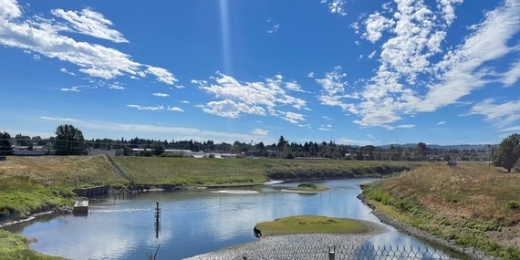 Levees and a pond enclosed by a fence