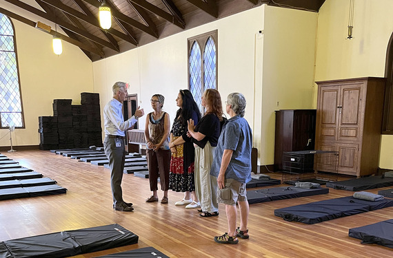 Mayor Wilson meets with community members during a tour of the St. Stephens overnight shelter.