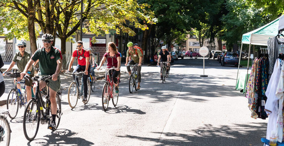 More than eight adults ride bikes through car-free Downtown Portland streets.