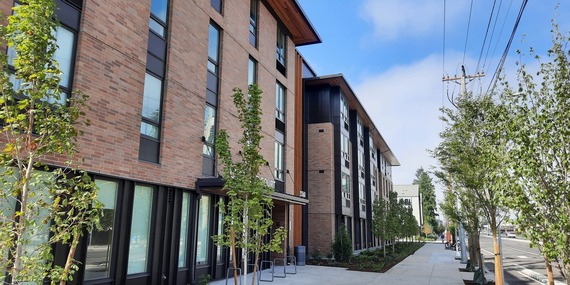 BPS - street-level view of two new, 4-story, apartment buildings