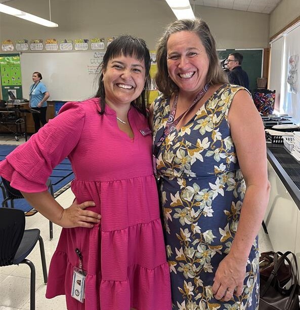 Councilor Tiffany Koyama Lane and Portland School Board Director Stephanie Engelsman smiling at the camera, standing in a classroom