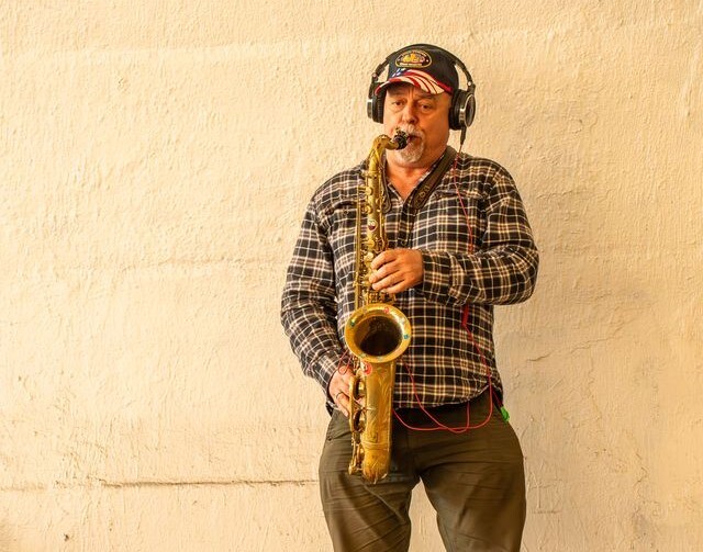 Alex plays saxophone in the tunnel