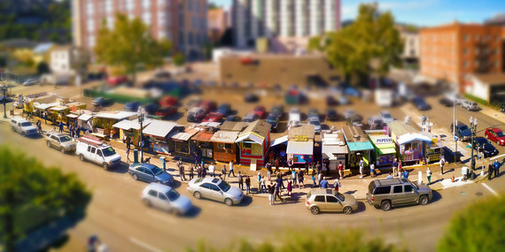 Miniature food carts, cars and people