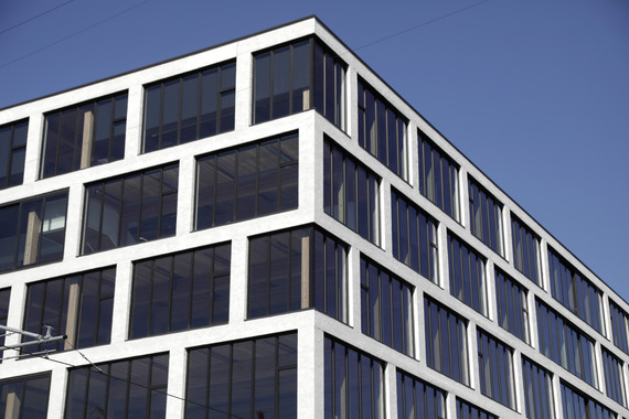 A white, multistory building designed by Hacker Architects - Design Commission image