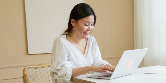 Woman typing on laptop computer