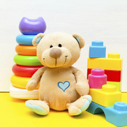 Teddy bear and other colorful toys