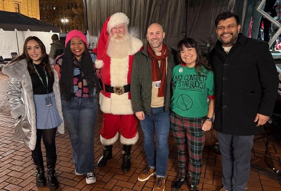 Portland City Councilors Morillo, Avalos, Zimmerman, Koyama Lane and Kanal with Santa in front of Portland's Tree at Pioneer Courthouse Square
