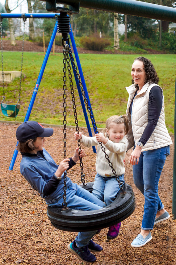 Council President Elana Pirtle-Guiney plays with her two children in a Portland park.