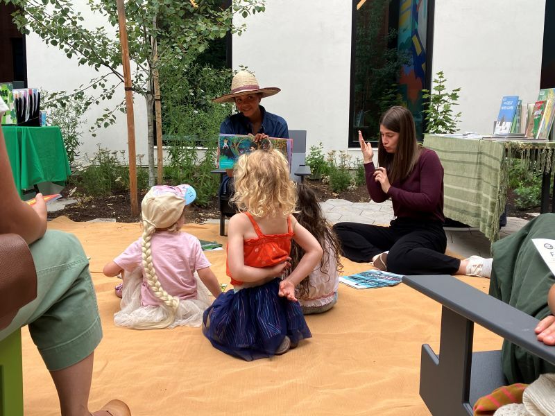 PPR - Woman reading book to group of children