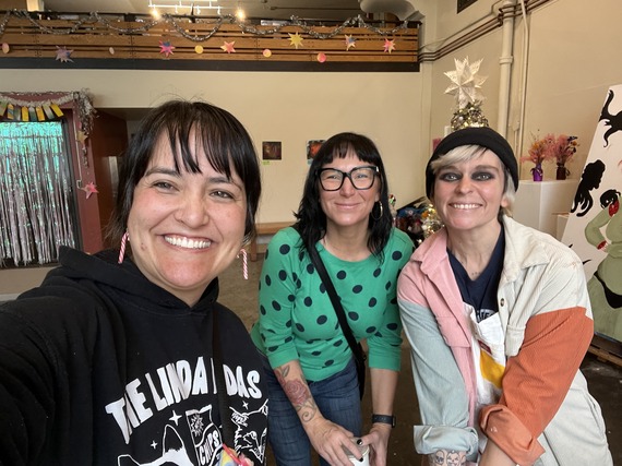 Three people at p:ear, smiling at the camera