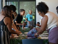 PPR - People standing at a tabling making crafts