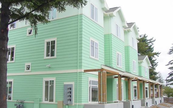 A row of light green houses for feedback on affordable housing recommendations