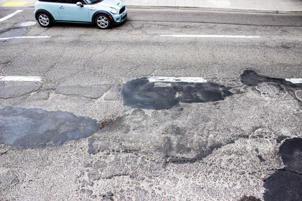 Pavement condition on SW Main Street before Fixing Our Streets-funded repaving
