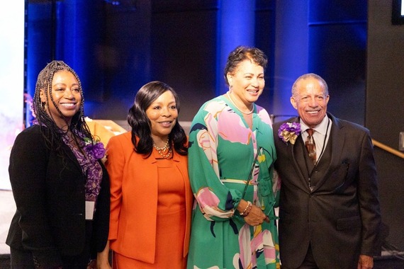 Leslie Goodlow is pictured with three other African American adults.