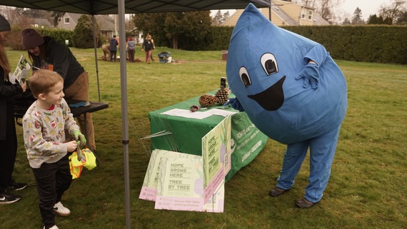 Drippy, the Water Bureau mascot, visits with the community 