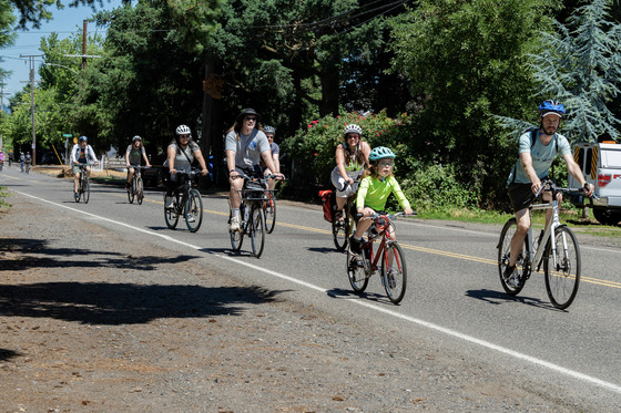 Families ride in a Sunday Parkways event in Cully in 2025