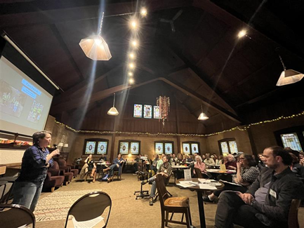 A presentation from Friends of Mount Tabor with people watching at their annual meeting