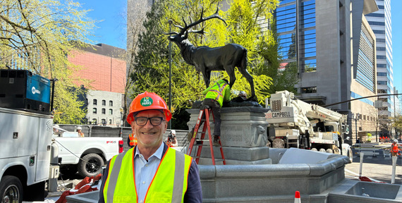 Councilor Dan Ryan standing in front of the newly reinstalled Thompson Elk Fountain on April 9, 2026.