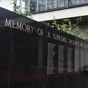A veterans memorial wall with names of soldiers