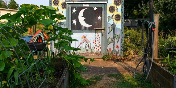 A colorful mural in a community garden