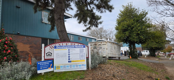 Deconstruction site with development notice