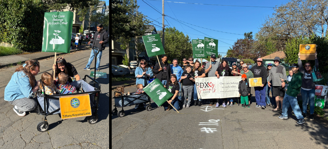 Councilor Koyama Lane talking to a mom and her two children in a wagon; large group of people holding a PDX Saints Love banner and signs 