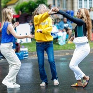 Three people dance in the middle of the street - graphic for Party on, Portland events