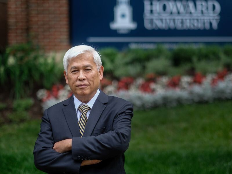 PPR - Man in blue suit with Howard University sign in the background
