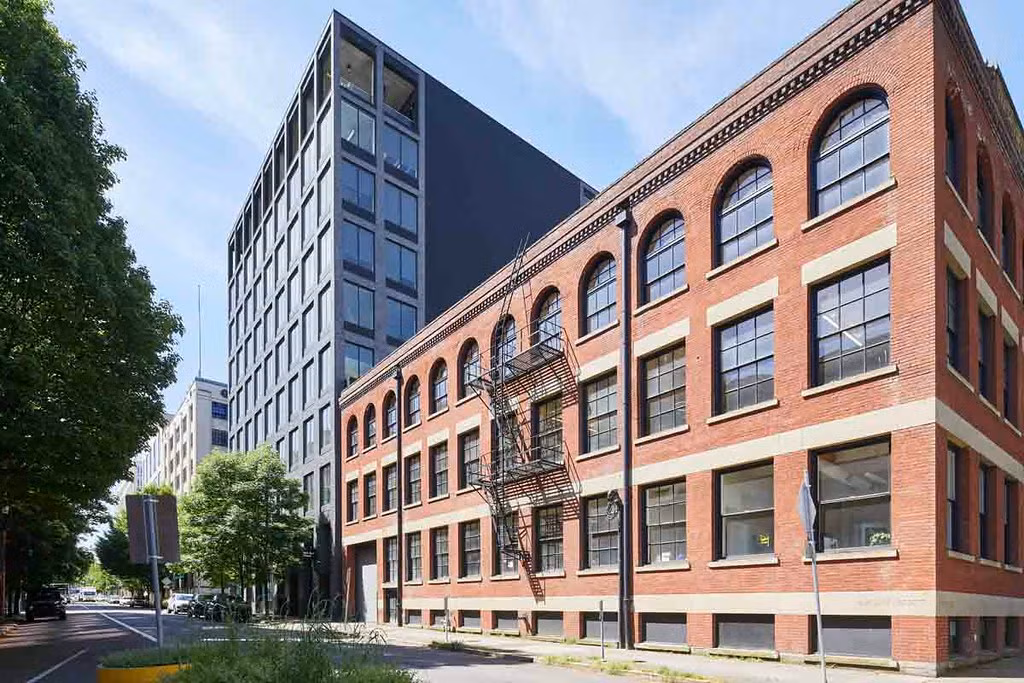 three-story brick building with fire escape