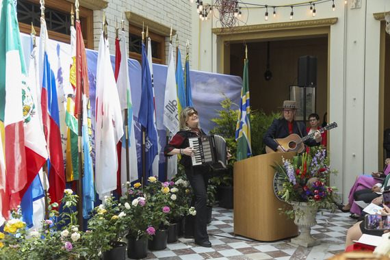 Two musicians play instruments and sing at City Hall during a celebration of Sister Cities and Lviv
