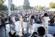 Dancers on stage singing to a large crowd during the 2022 East Portland Summer Arts Festival